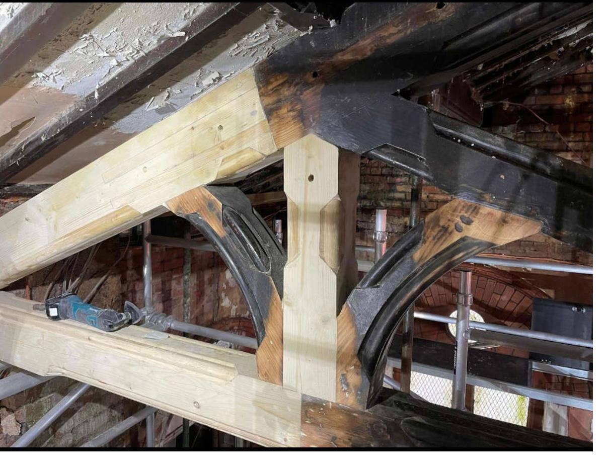 An oak truss restored with scarf joints.