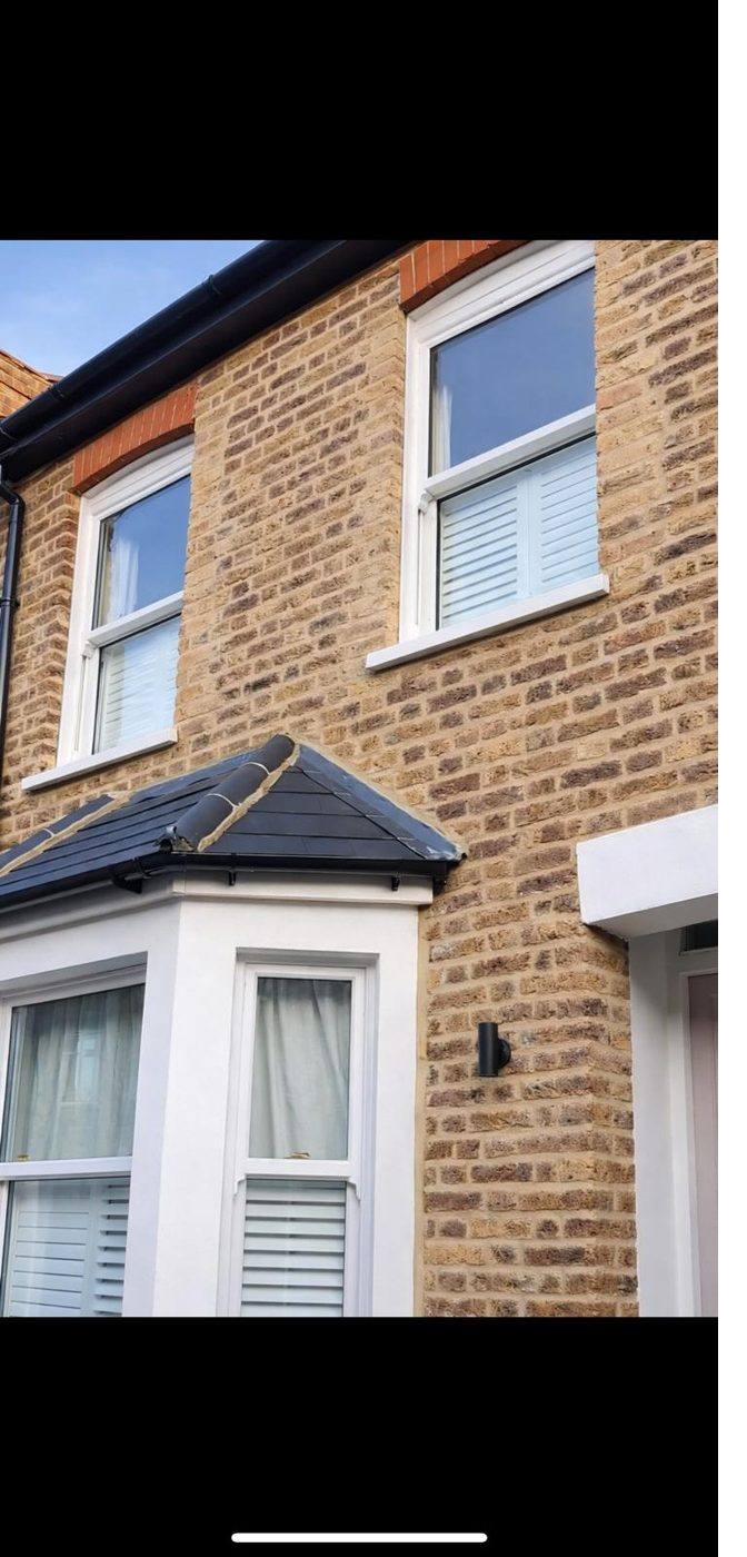 Restored Victorian red brick facade.