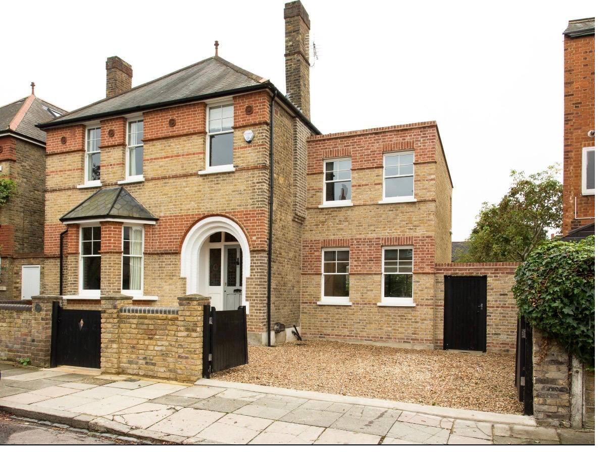A Victorian villa with a matching brick side extension.